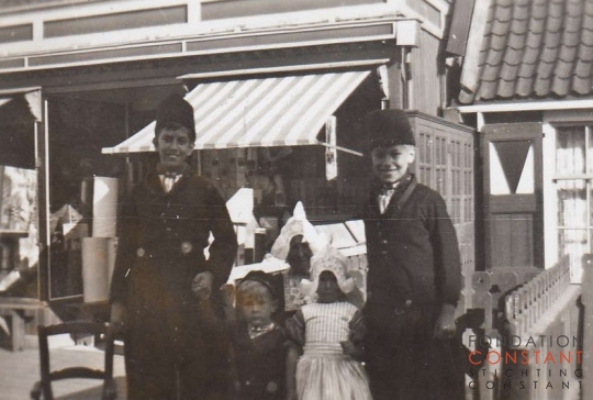 Constant, Jan and two small children in traditional Dutch costumes