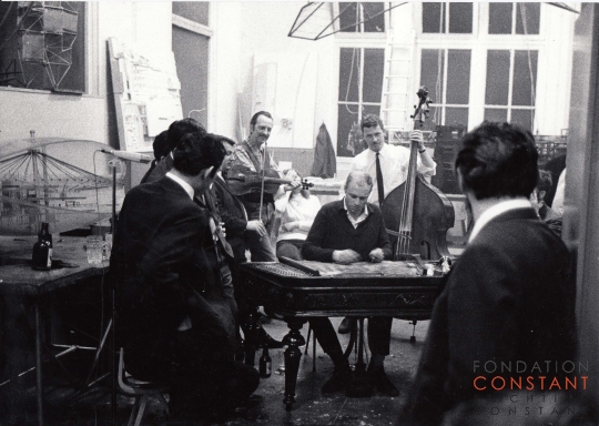 Constant makes music with Group of musicians