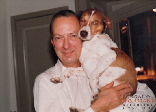 Constant holding his dog, Waldo.