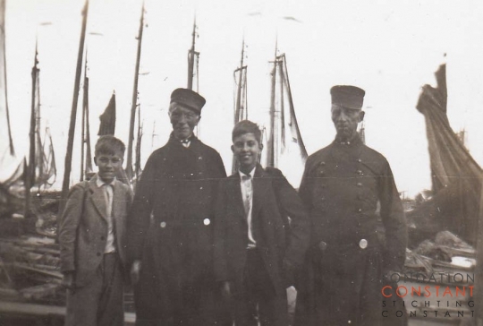 Constant, Jan and two other men in traditional Dutch costumes.