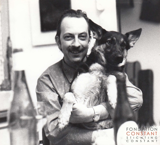 Constant with his dog Xinga on is lap