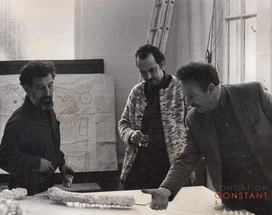 Haber, Constant and Volten standing next to a macquette