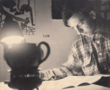 Constant reading the newspaper