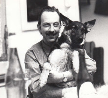 Constant with his dog Xinga on is lap